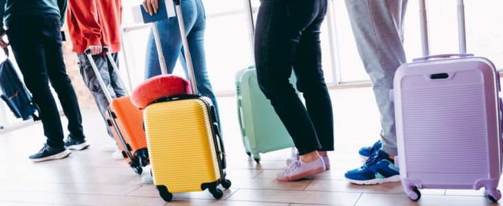 a group traveling with suitcases